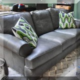 F24. Gray leather sofa. 